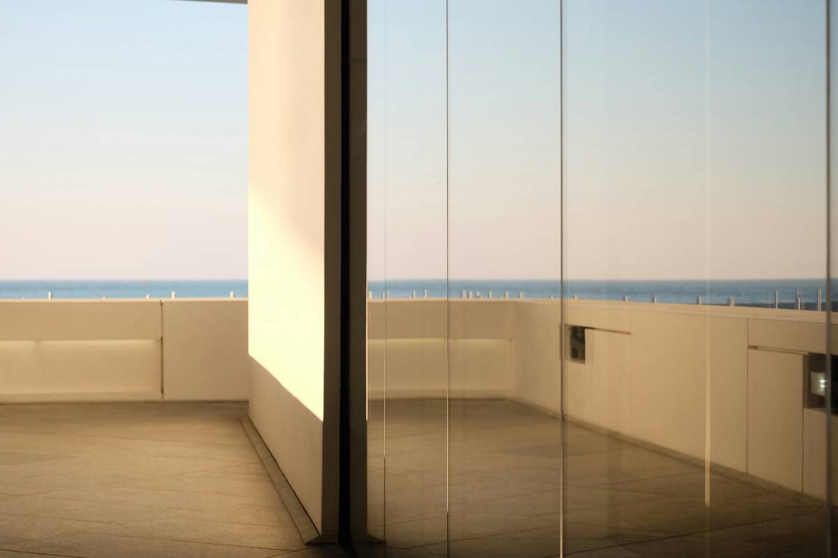 Diagram comparing clearance needed: hinged door (36in), sliding door (track intrusion), bi-fold door (6in fold-in space)