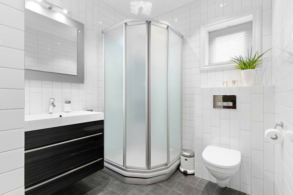 Diagram comparing space usage: hinged door (24-inch swing arc) vs. bi-fold door (6-inch folded depth)