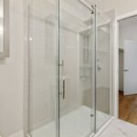 Bathroom Glass Door Replacement: Why Bi-Fold Doors Solve Your Shower Nightmare