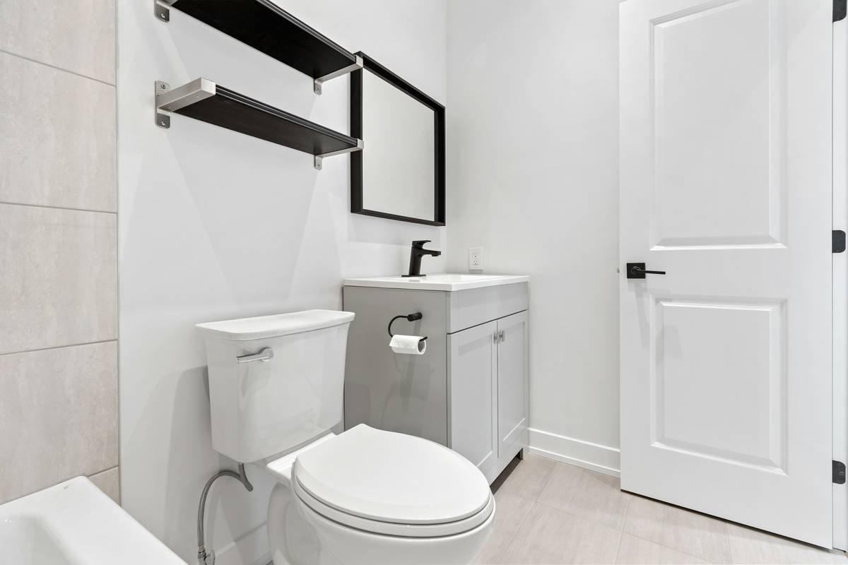 Bi-fold shower door mechanism demonstrating space saving shower room ideas